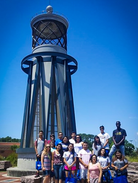 UB Students posing in front of lighthouse